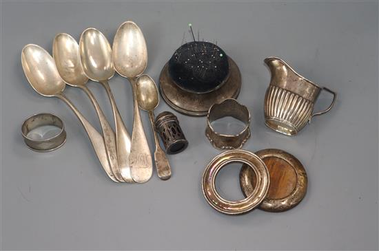 Four American sterling tablespoons, two silver mounted photo frames, a cream jug, pin cushion, spoon, pepper and 2 napkin rings